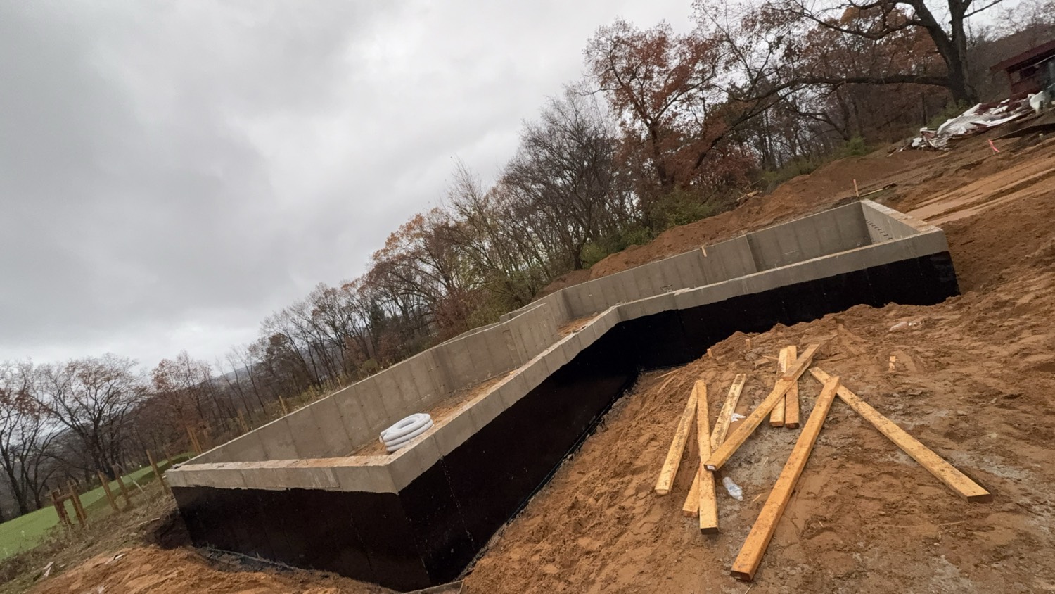 Concrete foundation walls with waterproofing