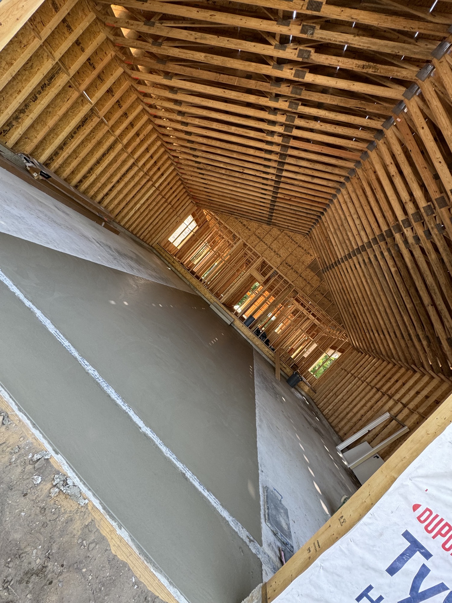 Fresh concrete slab inside new construction